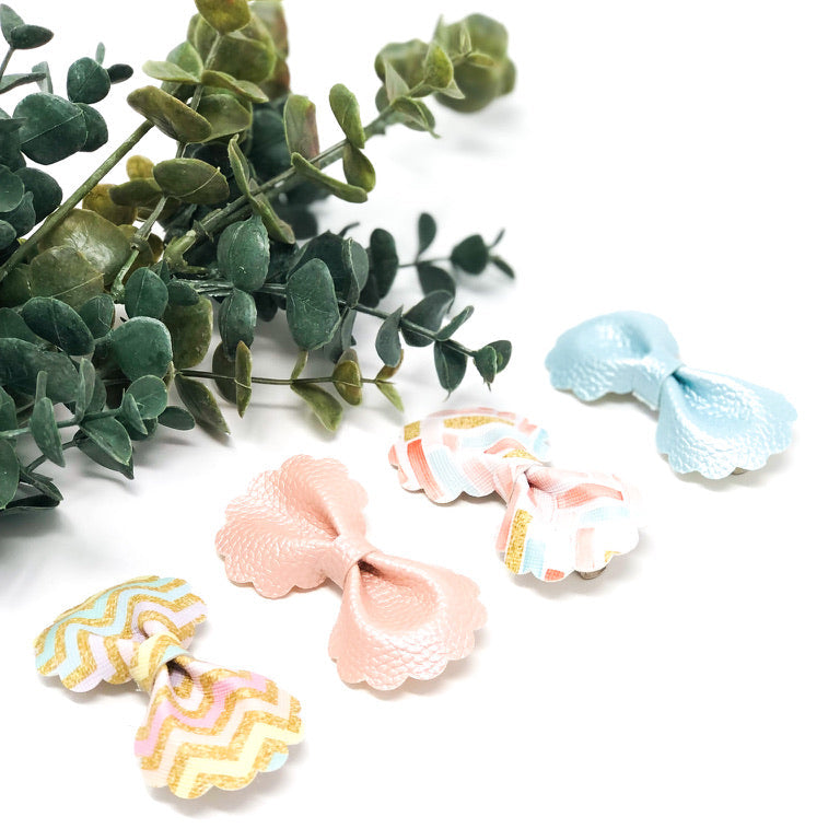 Ruffle Bloom Bow Collection handmade ruffle flower hair bows in coral pink, dusty blue, and spring zigzag pattern