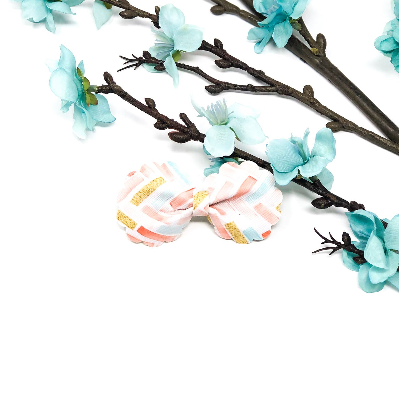 Ruffle Bloom Bow Collection handmade ruffle flower hair bows in coral pink, dusty blue, and spring zigzag pattern