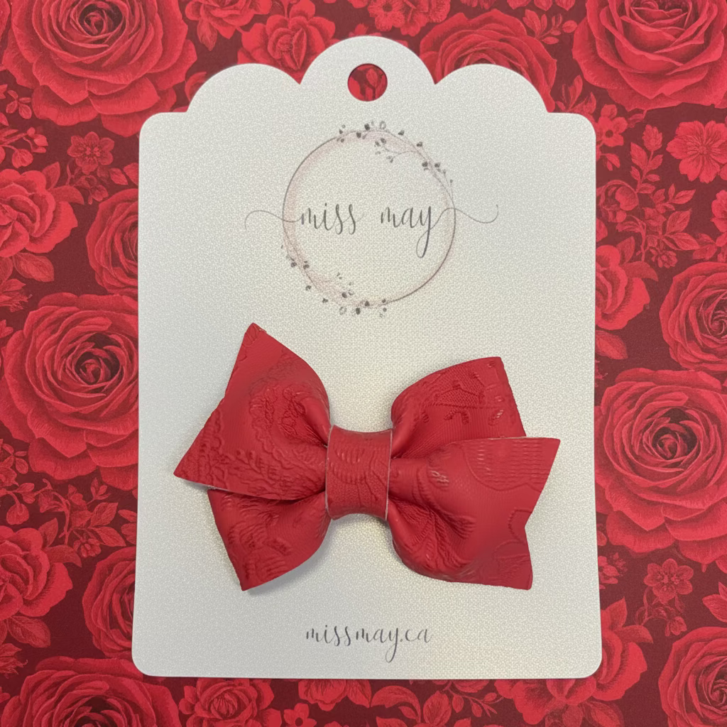 Soft red embossed faux leather bow hair clip for toddlers and kids, lightweight neutral hair accessory