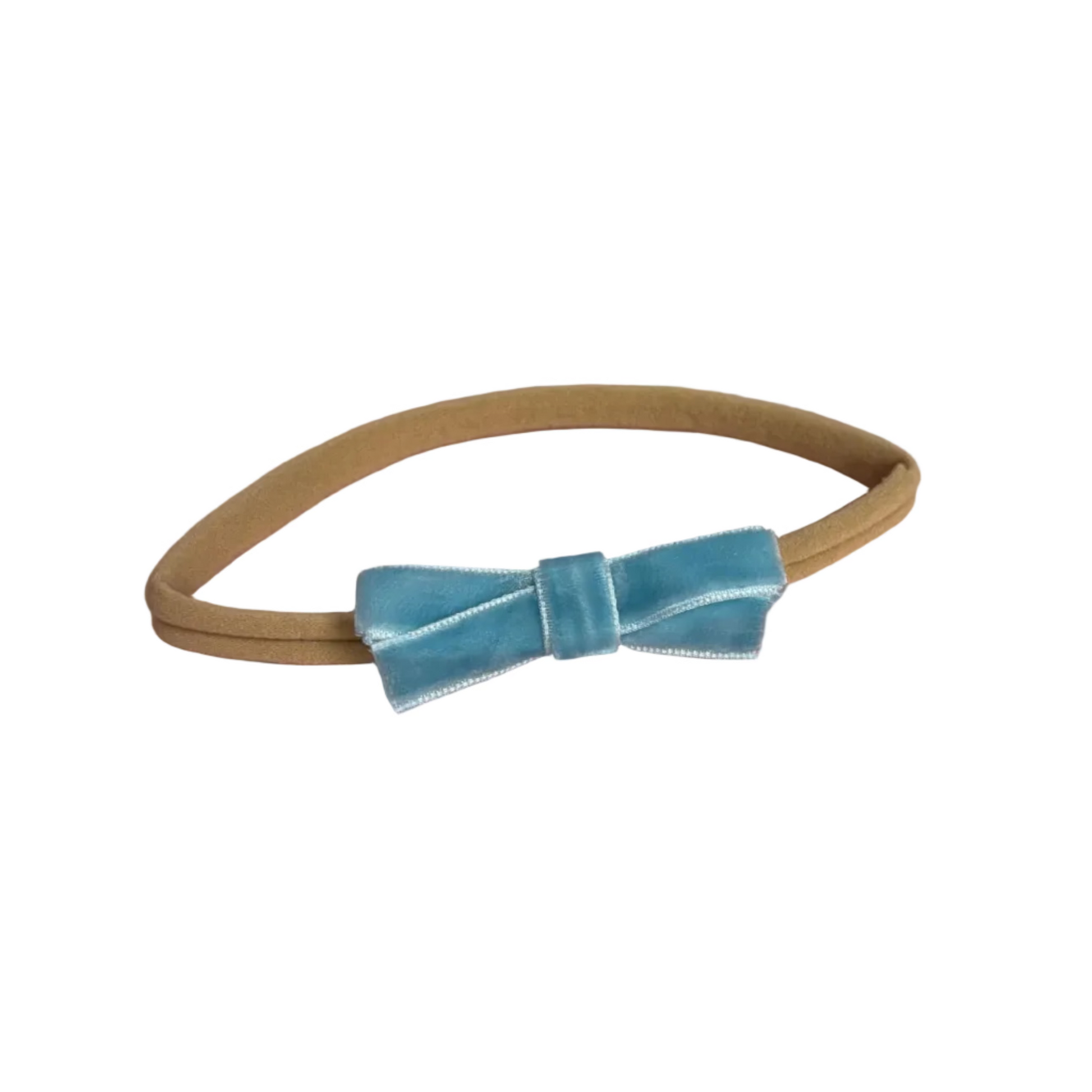Blue velvet hair bow on a beige nylon headband for newborns